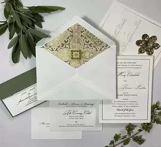 Gold foil with black printing. Exquisite gold metallic and green envelope liner. Colored envelope liner in this luxury wedding invitation suite.